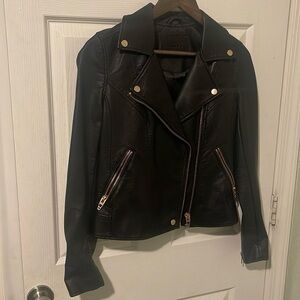 CoffeeShop Women's Black Leather Jacket with Silver Accents